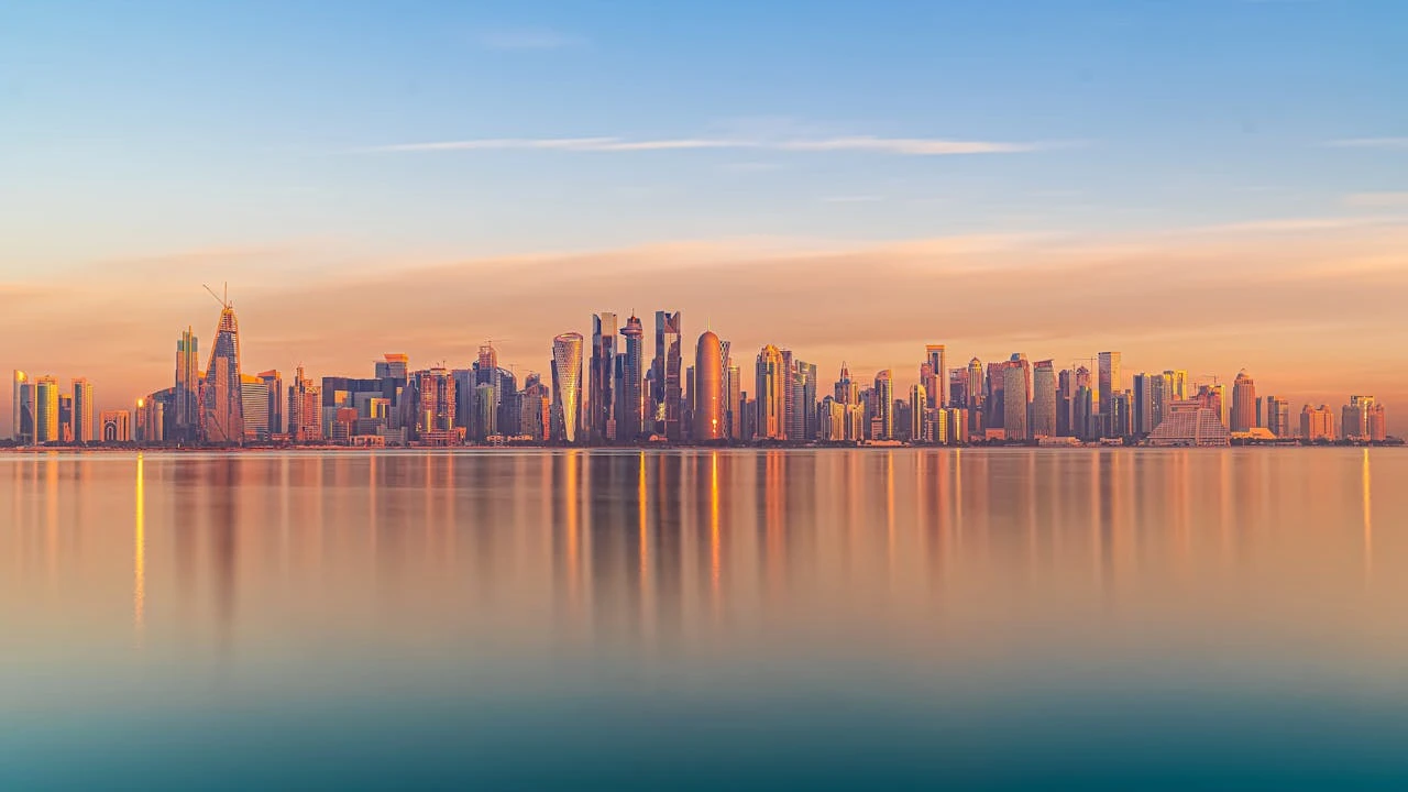 Doha skyline across the water at sunset