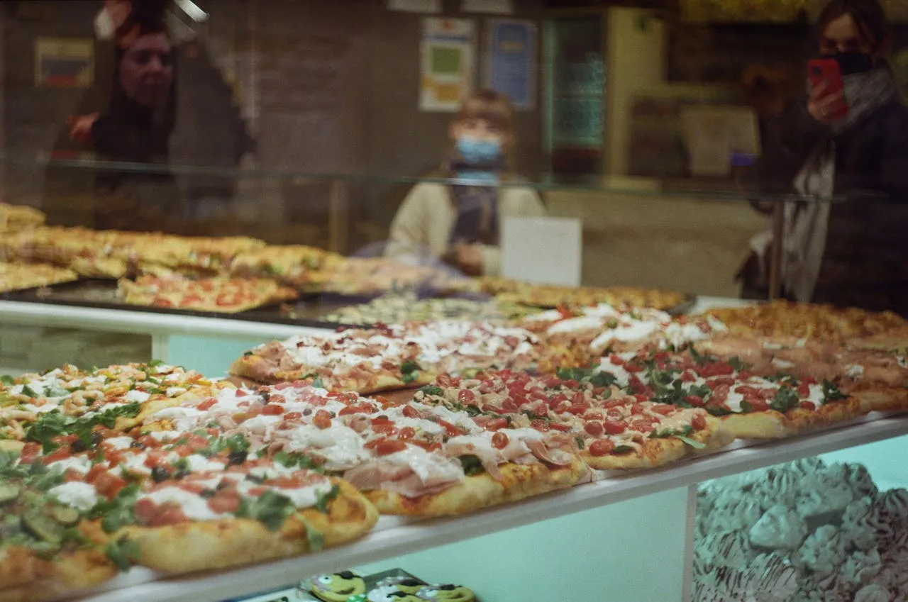 New York pizza slices at a counter