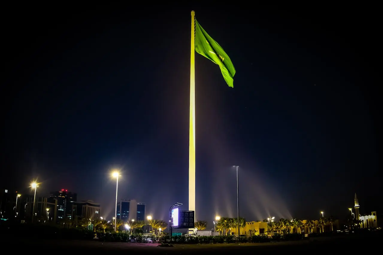 Saudi flag flying at night in Riyadh